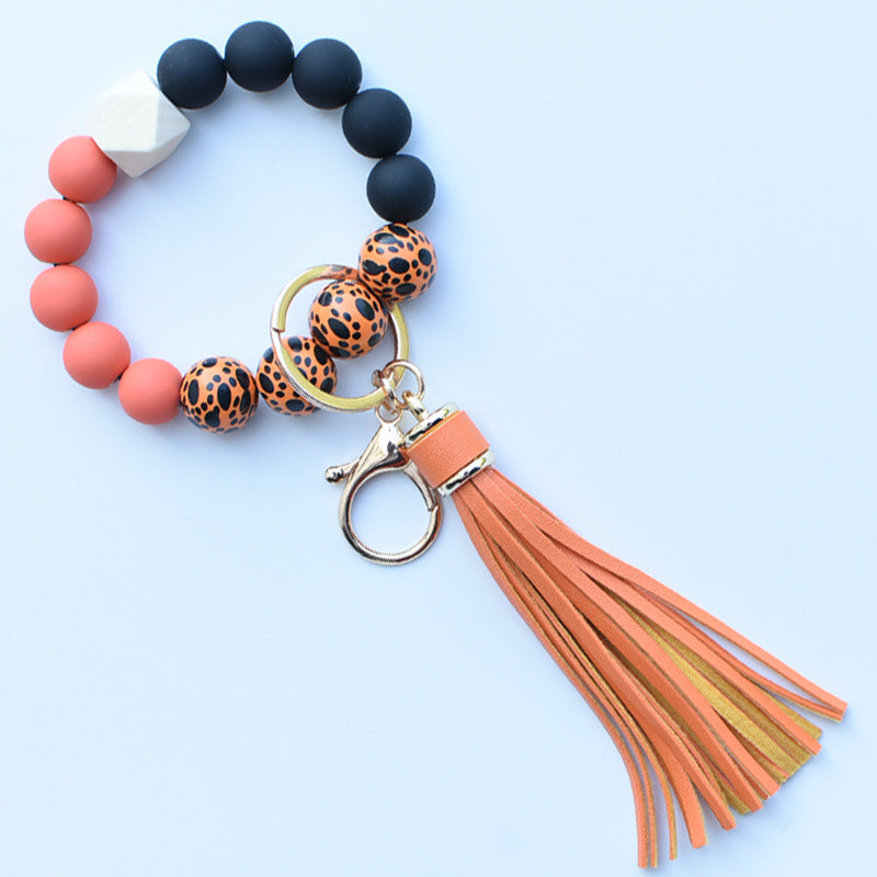 Wholesale Colorful leopard print silicone beaded bracelet keychain PU tassel pendant